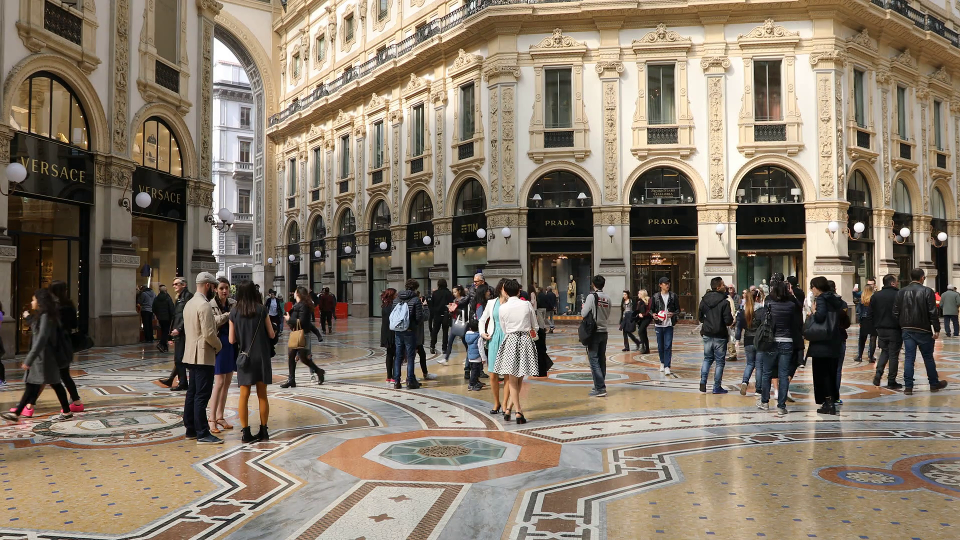 tourists-walking-for-shopping-inside-the-galleria-vittorio-emanuele-ii-gallery-in-piazza-duomo-square-famous-fashion-stores-like-prada-luxury-and-shopp